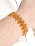 Bracelet micro-macramé doré spirale tissée perles dorées ajustable
